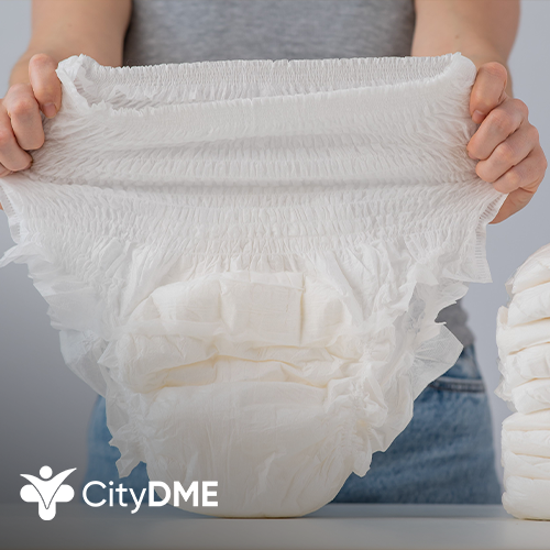 Person holding up an absorbent adult diaper